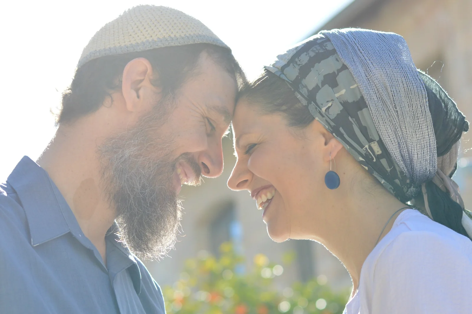 Hillel and Chaya Lester leaning their foreheads together